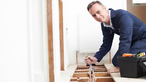 This is a photo of a man installing a heating system maybe in Sunderland