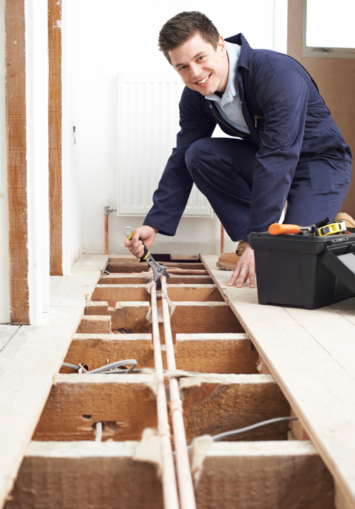 This is a photo of a heating engineer installing a heating system, maybe in Sunderland or the surrounding area